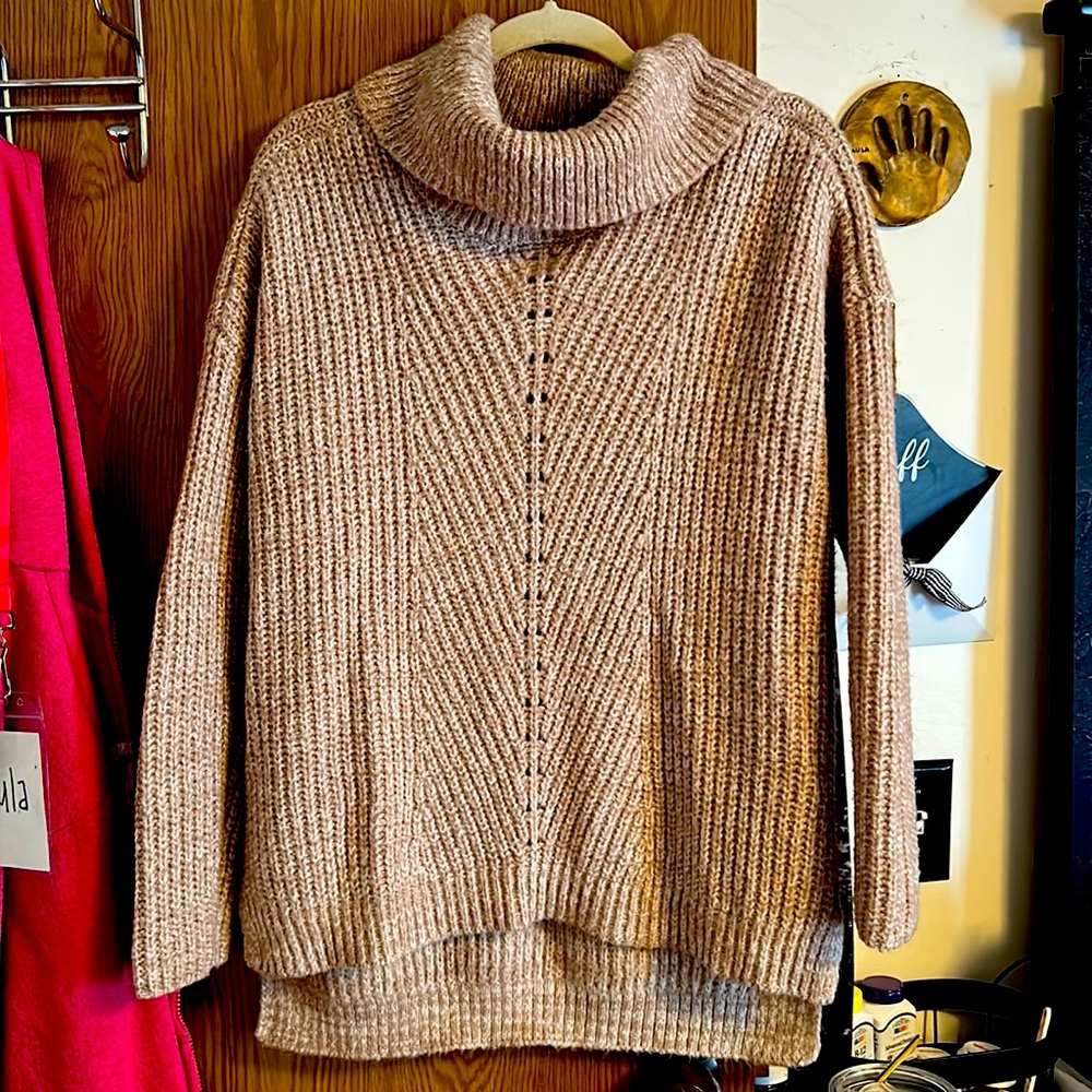 Tan and white knit sweater.